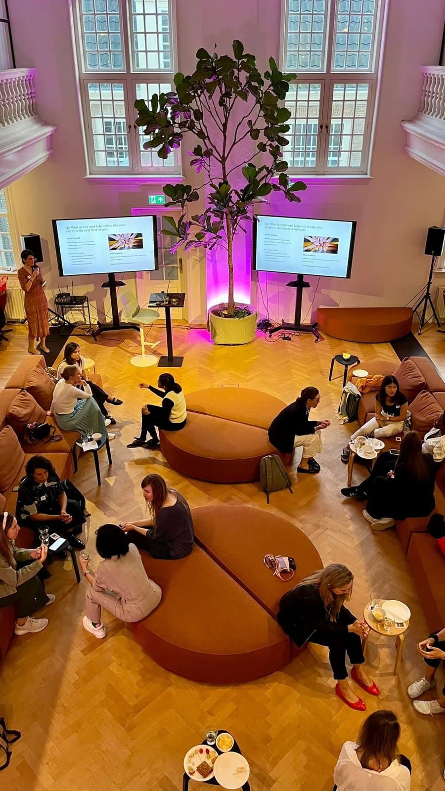 Attendees seated at a Women in Corporate Circles event in Amsterdam